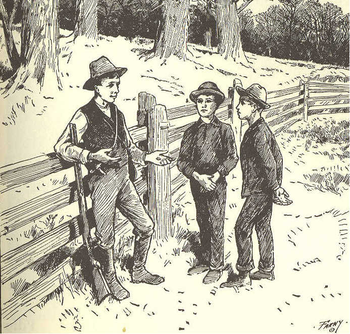 Three boys standing by a fence, one older than the others.