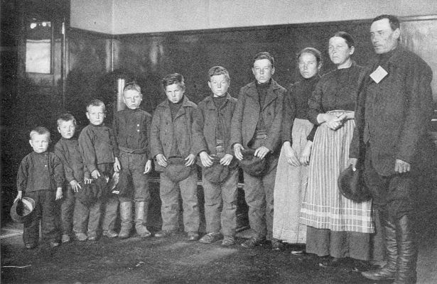 WHERE THE WORKERS COME FROM. Family of German
immigrants, passing through Ellis Island on their way to the Middle
West. (Courtesy of U.S. Immigration Station, Ellis Island.)