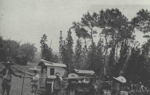 AUTHOR'S CARAVAN ON THE MARCH

On the main road west of Chung-king—the Author's four-man chair engaged
to "save his face," and his servant's two-man chair, followed by the
coolies.