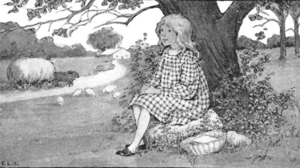 A fair little girl sat under a tree