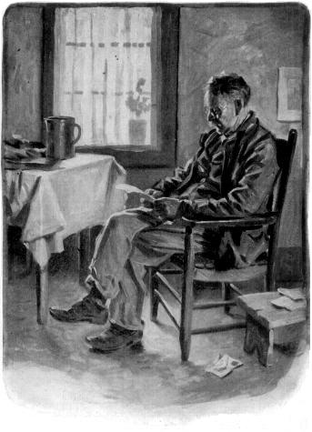 Man sitting reading a letter