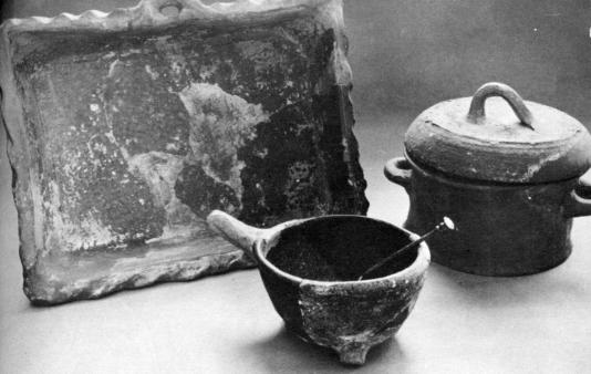 [Illustration: Many earthenware vessels found were used for cooking purposes, including baking dishes, three-legged pots, and covered pots.]