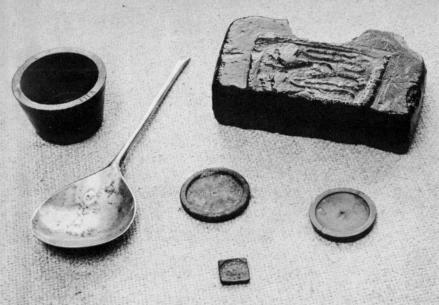 [Illustration: Brass weights and a piece of scrap brass unearthed at Jamestown. Records indicate that many metalworkers emigrated to Virginia during the 17th century.]