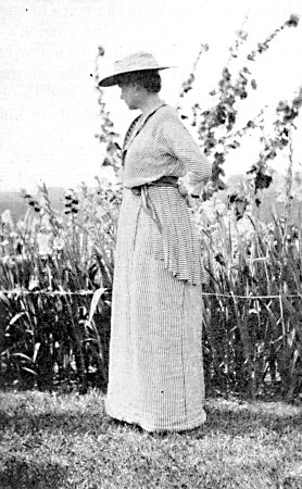 Mrs. Gertrude Ellis Skinner among her gladoli.