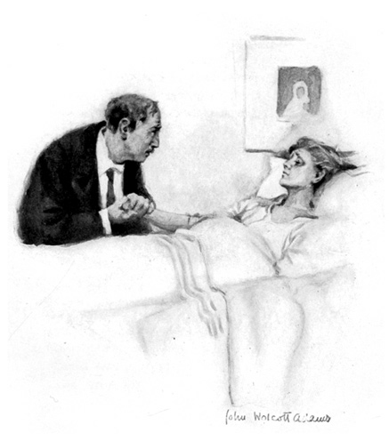 A man holds the hand of a woman who is lying in bed