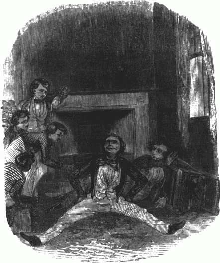 A boy fallen to the floor with other boys looking on.