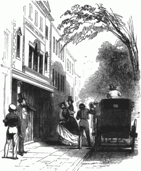 Two boys looking on as a lady exits a carriage.