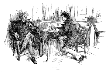 Two men having a conversation at a table.