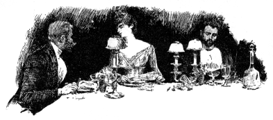A woman and man converse at table; a second man looks thoughtfully at his plate.