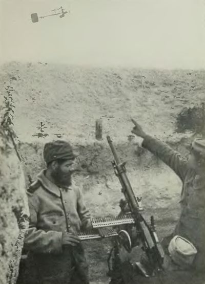 <i>Photo by Western Newspaper Union</i> French Hotchkiss Gun
Firing at Aeroplane