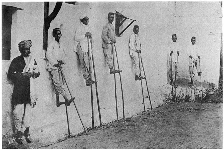 Hindu boys on stilts