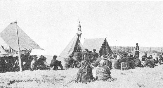 INDIANS RECEIVING TREATY PAYMENT ON PRAIRIE.