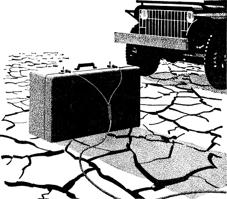 suitcase with attached wires, and jeep in background