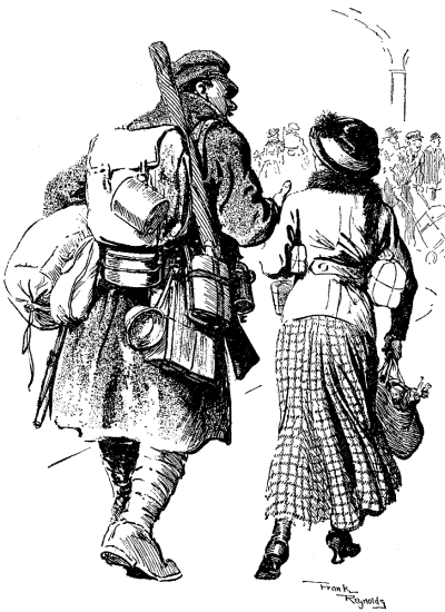 Heavily laden British soldier walking
with a small woman with packages.