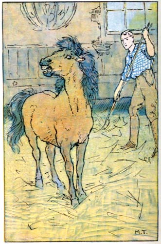 A pony in a stall with a man with a pitchfork behind