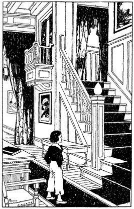 A small boy standing at the base of a staircase