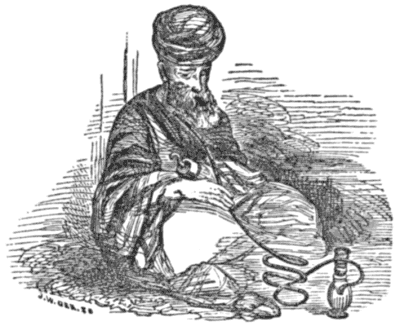 A one-handed man sits holding a hookah pipe