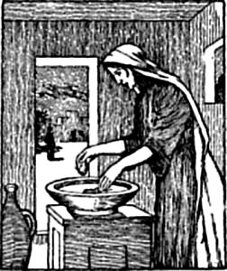 A woman kneading a bowl of dough.