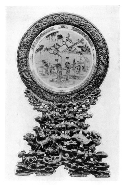 FIG. 57.—CARVED PLAQUE STAND.