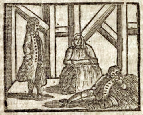 A man standing, a man lying on the ground, and a seated woman