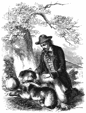 A man, with a dog crouching in front of him