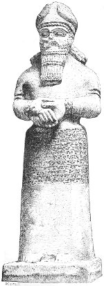 Fig. 15.—Statue of Nebo; from Nimroud. British Museum.
Calcareous stone. Height 6 feet 5 inches.