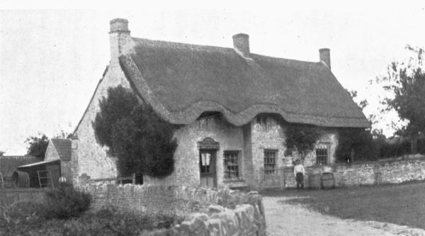 HORTON THATCHED POST OFFICE AT THE FOOT OF COTSWALD HILLS.