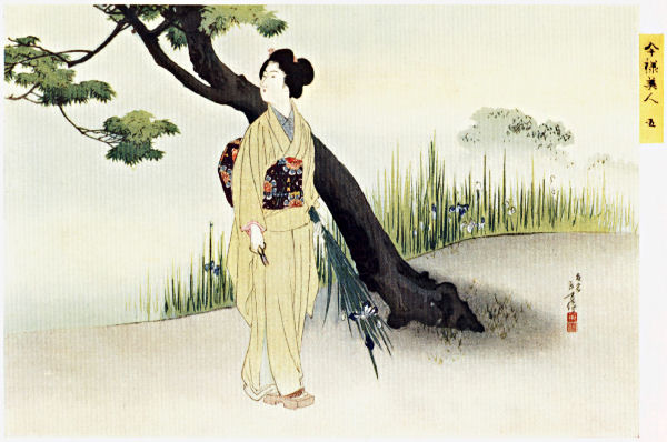 A Japanese woman stands next to a tree