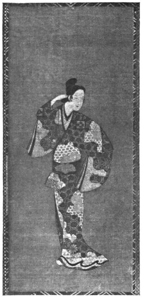 A posed figure wearing a kimono