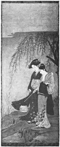 Two women stand beside a tree