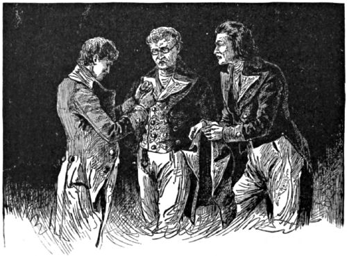 Three men examine a locket