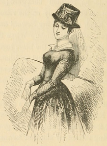 Woman in riding dress, with hat and veil and whip under her arm