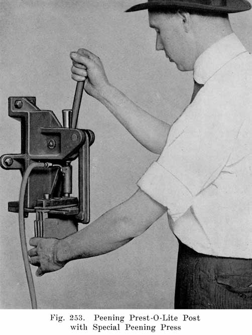 Fig. 253 Peening Prest-O-Lite post with special peening press