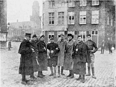 WITH A GROUP OF BELGIAN OFFICERS AT FURNES, BELGIUM, 1914.
ONE OF THEM USED TO ACT AS MY COURIER
