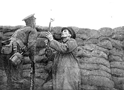 CHOOSING A POSITION FOR MY CAMERA IN THE FRONT LINE TRENCH AT PICANTIN, WITH THE GUARDS.
WINTER, 1915-16