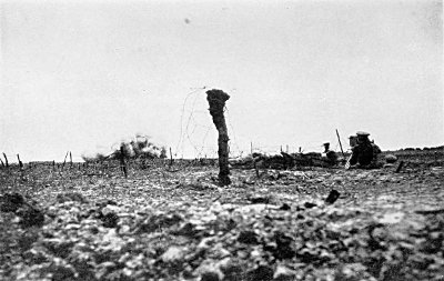 IN A SHELL HOLE IN "NO MAN'S LAND" FILMING OUR HEAVY BOMBARDMENT OF THE GERMAN LINES. I GOT
INTO THIS POSITION DURING THE NIGHT PREVIOUS. IT WAS HERE THAT I EARNED THE SOUBRIQUET "MALINS
OF NO MAN'S LAND"