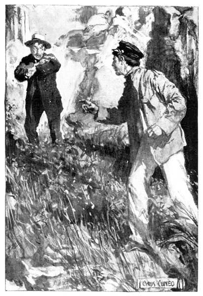 A man pointing a pistol at another man.