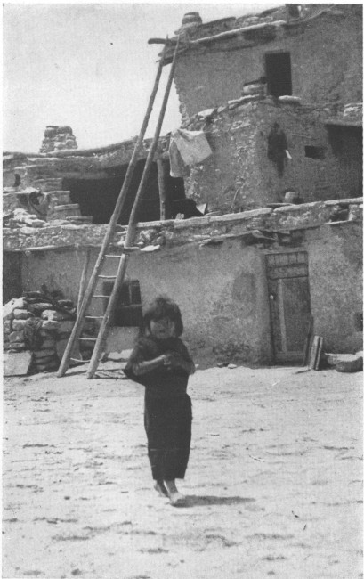 A shy little Indian maid in a Hopi village of Arizona