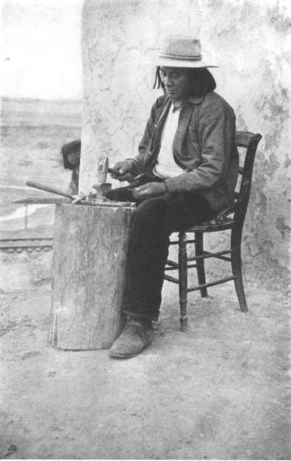 A fashionable metal-worker of Taos, New Mexico, who has
not adhered to the native costume