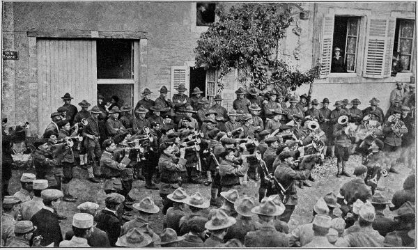 Copyright by the Committee on Public Information.

Buglers of the Alpine Chasseurs, assisted by their military band,
entertaining American soldiers of the First Division.