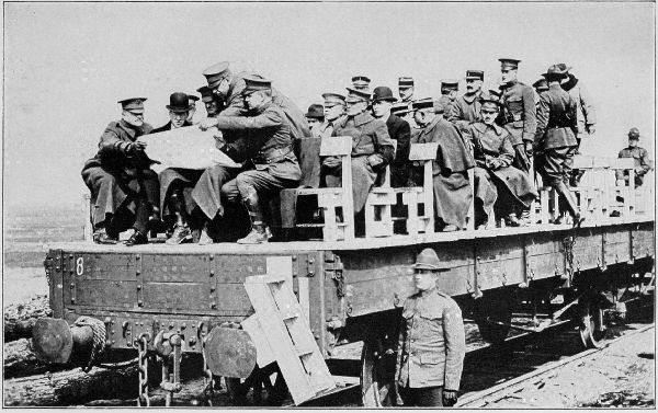 Copyright by the Committee on Public Information.

Secretary Baker riding on flat car during his tour of inspection of the
American Expeditionary Forces.