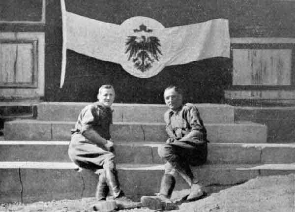 General Frank's house, Windhuk. Photo of the two first men there taken under the flag hauled down by us