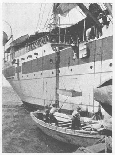 Wounded being placed on Hospital Ship.