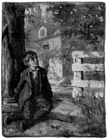 Boy in front of house