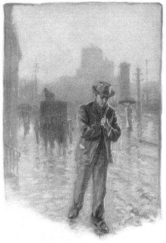 Man on a rainy city street