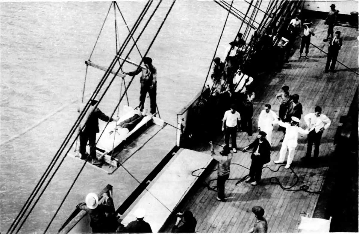 THE ATTACK ON THE "PEGASUS" BY THE "KNIGSBERG" (NOW
"IMPRISONED"): TRANSHIPPING WOUNDED TO THE HOSPITAL-SHIP "GASCON."