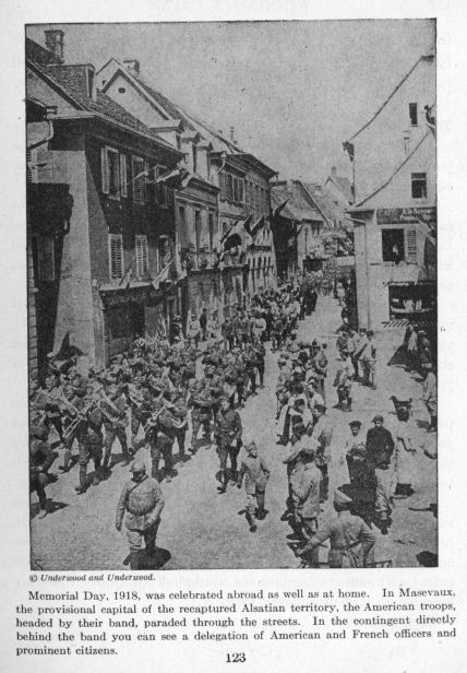 Memorial Day, 1918, was celebrated abroad as well as at home.  In Masevaux, the provisional capital of the recaptured Alsatian territory, the American troops, headed by their band, paraded through the streets.  In the contingent directly behind the band you can see a delegation of American and French officers and prominent citizens.