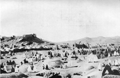 Women Visiting Graves of Relatives, Birjand. (Ruined Fort can be observed on Hill.)