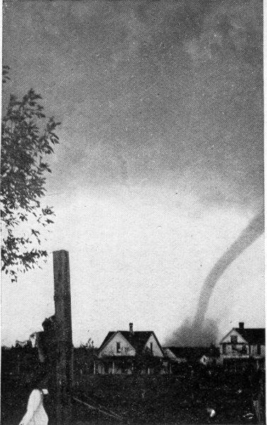 Tornado wrecking a farm.