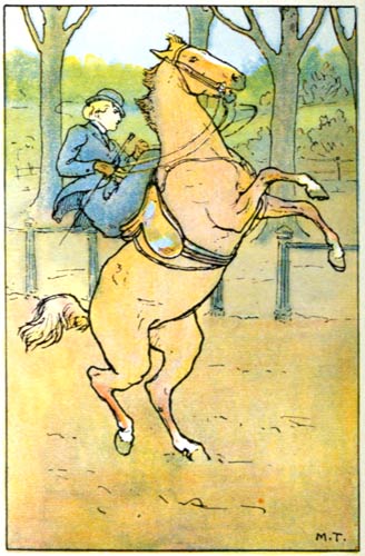 A woman riding sidesaddle on a rearing horse